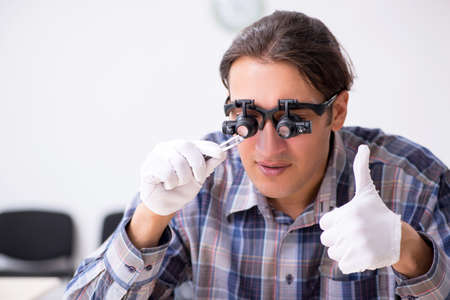 Young male jeweler at workshop