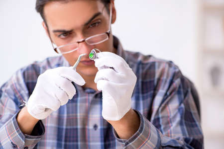 Young male jeweler at workshop