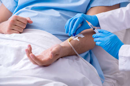 Male patient in blood transfusion concept