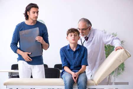 Young boy visiting doctor in hospitalの写真素材
