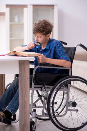 Disabled kid preparing for school at homeの写真素材