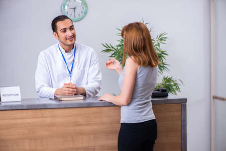 Young patient at the reception in the hospitalの写真素材
