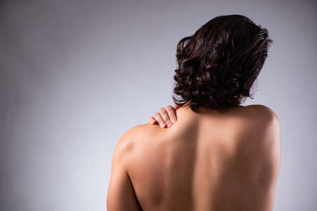 Young man suffering from upper limb pain