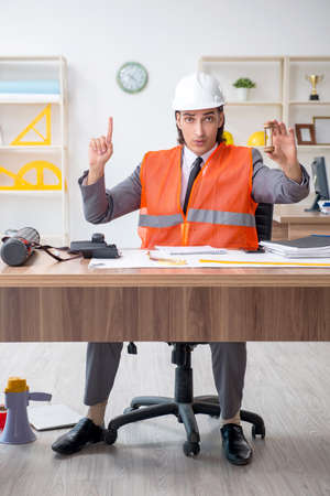 Young male architect working in the officeの写真素材