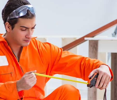 Contractor working on laminate wooden floor