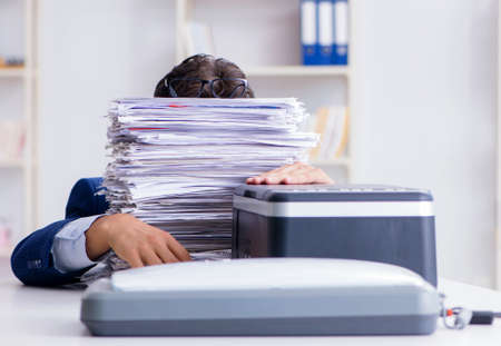 Businessman making copies in copying machineの写真素材