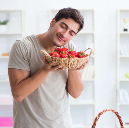 The young man in healthy eating and dieting conceptの写真素材