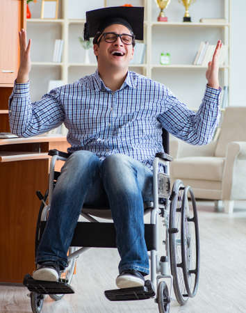 The disabled student studying at home on wheelchairの写真素材