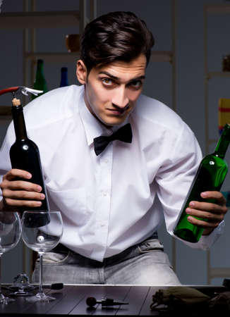 The professional sommelier tasting wine in restaurantの写真素材