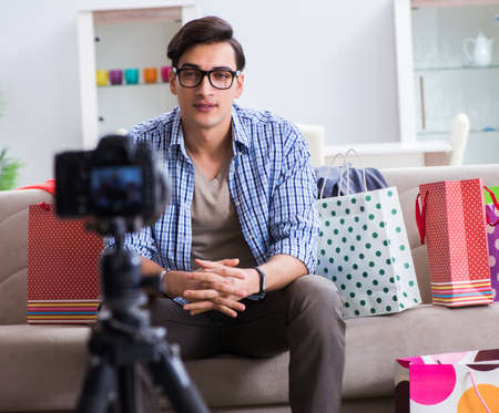 Male fashion blogger recording video for vlogの写真素材