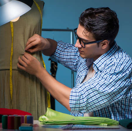 Male tailor working in sewer shopの写真素材