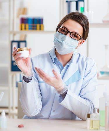Lab chemist checking beauty and make-up productsの写真素材