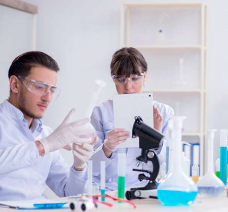 Team of chemists working in the lab
