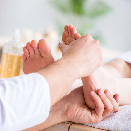 Foot massage in medical spaの写真素材