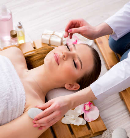 Young woman during spa procedure in salonの写真素材