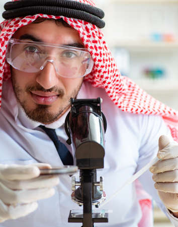 Arab chemist working in the lab officeの写真素材