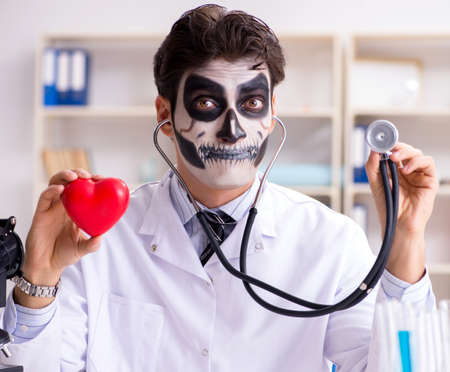 Scary monster doctor working in labの写真素材
