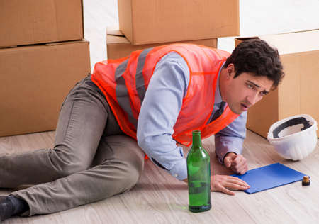 Delivery man drunk at workの写真素材