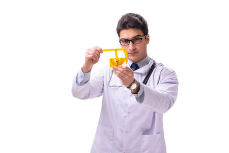 Young male doctor with goniometer isolated on whiteの写真素材