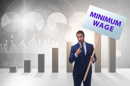 Concept of minimum wage with businessmanの写真素材