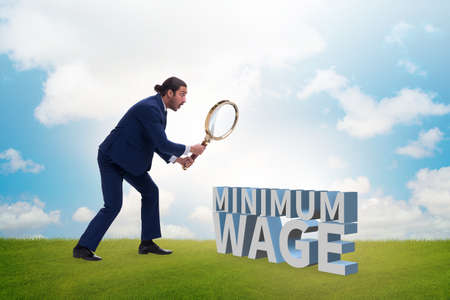 Concept of minimum wage with businessmanの写真素材