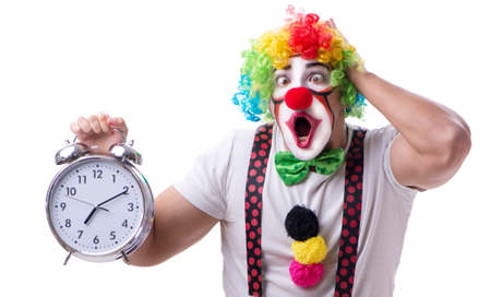 Funny clown with an alarm clock isolated on white backgroundの写真素材