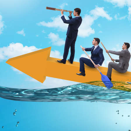 Teamwork concept with businessmen on boatの写真素材