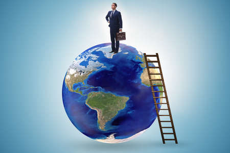 Businessman on top of the worldの写真素材