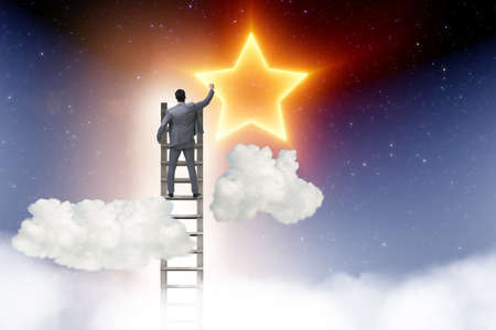 Businessman reaching out for stars