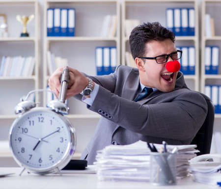 Clown businessman working in the office angry frustrated with aの写真素材