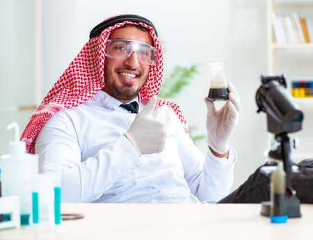Arab chemist working in the lab officeの写真素材