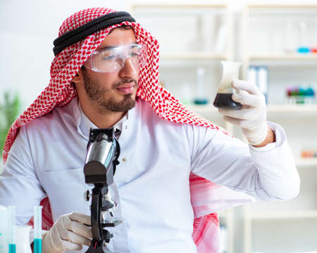 Arab chemist working in the lab officeの写真素材