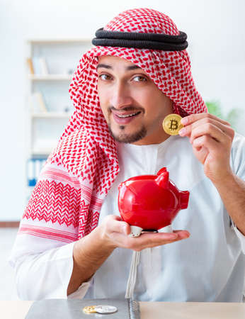 Arab man with bitcoin in cryptocurrency mining conceptの写真素材