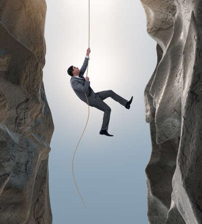 Businessman overcoming challenges in business conceptの写真素材