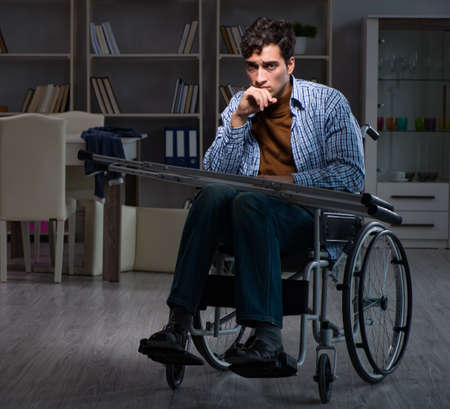 Man suffering from depression at wheelchair