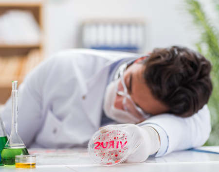 Male doctor working in the lab on virus vaccineの写真素材