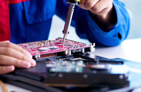 Repairman working in technical support fixing computer laptop trの写真素材