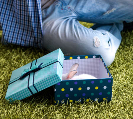 Young man getting rabbit as birthday present