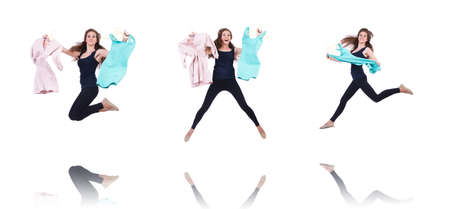Woman trying new clothing on whiteの写真素材