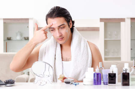 Young handsome man in the bathroomの写真素材