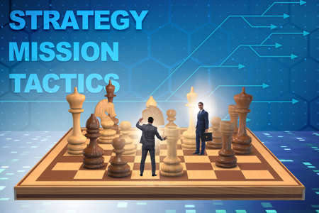 Businessman in large chess board in strategy conceptの写真素材