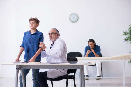 Young boy visiting doctor in hospitalの写真素材