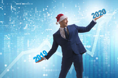 Businessman looking into future 2020 from 2019の写真素材