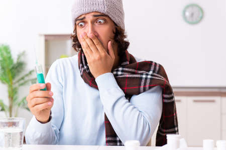 Young man suffering from flu at home