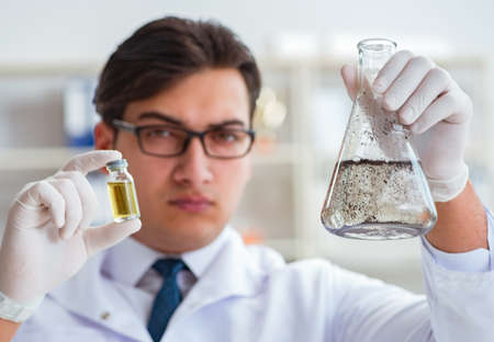 Young researcher scientist doing a water test contamination expeの写真素材