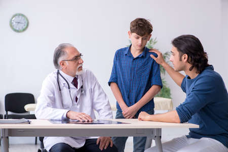 Young boy visiting doctor in hospitalの写真素材