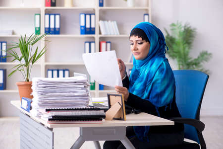 Female employee in hijab working in the officeの写真素材