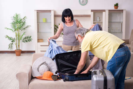 Old couple preparing for vacation travelの写真素材