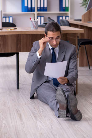 Unhappy male businessman in the officeの写真素材