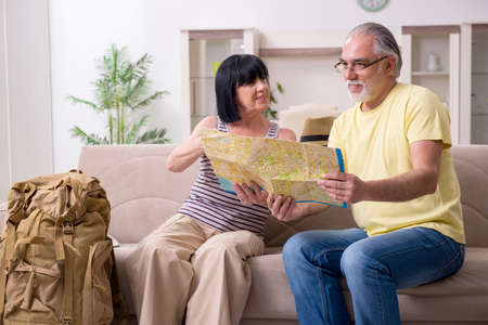 Old couple preparing for vacation travelの写真素材